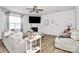 Inviting living room featuring a ceiling fan, fireplace, and two sofas for comfortable seating at 9203 Mackinaw Dr, Gastonia, NC 28056