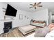 Well-lit living room boasts a mounted TV, fireplace, comfortable seating and stylish shelving at 9203 Mackinaw Dr, Gastonia, NC 28056