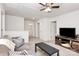 Comfortable living area with a gray couch, dark wood accents, and plenty of space for relaxing and entertaining at 9203 Mackinaw Dr, Gastonia, NC 28056