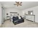Spacious main bedroom features vaulted ceilings, a sitting area, neutral decor, and an ensuite bathroom at 9203 Mackinaw Dr, Gastonia, NC 28056