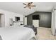 Relaxing main bedroom with a ceiling fan, a seating area and a white dresser with a TV at 9203 Mackinaw Dr, Gastonia, NC 28056