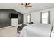 Relaxing main bedroom with a ceiling fan, a seating area and gray curtains at 9203 Mackinaw Dr, Gastonia, NC 28056