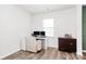 Well-lit office area with modern desk setup and dark wood cabinet at 9203 Mackinaw Dr, Gastonia, NC 28056