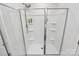 Beautiful white shower with a glass door and multiple shelves for toiletries at 9203 Mackinaw Dr, Gastonia, NC 28056
