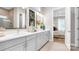 Bathroom featuring double vanity with quartz countertop, modern fixtures, and view into the bedroom at 1039 Rabbit Hill Ln, Monroe, NC 28110