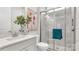 Modern bathroom featuring a glass-enclosed shower with white tile surround and quartz countertop vanity at 1039 Rabbit Hill Ln, Monroe, NC 28110