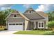 Charming single-Gathering home showcases a two-car garage and well-manicured lawn at 1039 Rabbit Hill Ln, Monroe, NC 28110