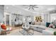 Bright living room with large sectional, coffered ceiling, and an open floor plan with sightlines to the kitchen at 1039 Rabbit Hill Ln, Monroe, NC 28110