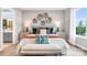 Serene main bedroom with a decorative wall, large windows, and a plush king-size bed with bench at 1039 Rabbit Hill Ln, Monroe, NC 28110