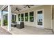 Covered patio with outdoor seating, ceiling fans, and view of the backyard at 1039 Rabbit Hill Ln, Monroe, NC 28110