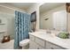 This bathroom has a tub with shower, blue shower curtain and is nautical themed at 1051 Lookout Shoals Dr, Fort Mill, SC 29715