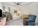Cozy bedroom furnished with a daybed, chair, and a dresser, illuminated by natural light at 1051 Lookout Shoals Dr, Fort Mill, SC 29715