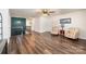 Bright, open upstairs landing with wood flooring and a view of stylishly arranged armchairs at 1051 Lookout Shoals Dr, Fort Mill, SC 29715