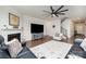 Bright living room with a fireplace, a large TV, with plush seating arrangements at 1051 Lookout Shoals Dr, Fort Mill, SC 29715