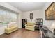 Bright living room featuring wood floors, a large window and comfortable seating at 1051 Lookout Shoals Dr, Fort Mill, SC 29715