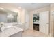 This main bathroom has a large shower and a view into the main bedroom at 1051 Lookout Shoals Dr, Fort Mill, SC 29715