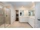 This main bathroom has a large shower and a dual sink vanity at 1051 Lookout Shoals Dr, Fort Mill, SC 29715