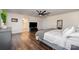 This is a view of the main bedroom with wood floors and a large window at 1051 Lookout Shoals Dr, Fort Mill, SC 29715