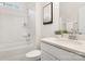 Modern bathroom featuring a shower-tub combo, white vanity, and contemporary fixtures at 111 Noah Ln, Troutman, NC 28166