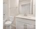 Modern bathroom with a white vanity and contemporary fixtures at 111 Noah Ln, Troutman, NC 28166