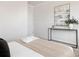 Cozy bedroom featuring modern wall art and sleek console table with decor items, creating a serene atmosphere at 111 Noah Ln, Troutman, NC 28166