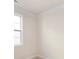 Bright bedroom features a window for natural light and neutral walls with white trim at 111 Noah Ln, Troutman, NC 28166