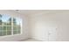 Sunlit bedroom featuring a double window, and a closet at 111 Noah Ln, Troutman, NC 28166