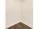 Empty walk-in closet showing wood floor, base molding and wire shelving for storage at 111 Noah Ln, Troutman, NC 28166