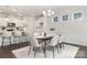 Spacious dining room adjacent to the kitchen area, offering hardwood floors and plenty of natural light from nearby windows at 111 Noah Ln, Troutman, NC 28166