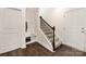 Functional entryway with a staircase, hall tree with hooks and bench seating, blending style and practicality at 111 Noah Ln, Troutman, NC 28166