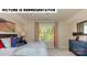 Inviting bedroom with a cozy bed, soft lighting, and view of the outdoors at 113 Noah Ln, Troutman, NC 28166