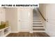 Hallway featuring an entryway bench with storage and a staircase to the upper level at 113 Noah Ln, Troutman, NC 28166