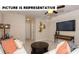 Comfortable living area with a TV, neutral walls, and lots of pillows at 113 Noah Ln, Troutman, NC 28166