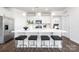 Bright kitchen with a large island, breakfast bar, stainless steel appliances, and stylish finishes at 115 Noah Ln, Troutman, NC 28166