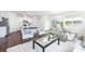 Open-concept living area with kitchen, dining, and living spaces, perfect for entertaining at 115 Noah Ln, Troutman, NC 28166