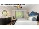 Bright bedroom with a ceiling fan, large window, white walls, and patterned rug at 117 Noah Ln, Troutman, NC 28166