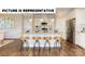 Stylish kitchen with stainless steel appliances, granite countertops, and seating area at 117 Noah Ln, Troutman, NC 28166