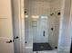 Contemporary glass shower with white subway tile surround and a built in bench at 157 Powder Spring Dr, Statesville, NC 28677