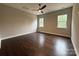 Bright bedroom featuring a ceiling fan, recessed lights, and scenic views from two windows at 157 Powder Spring Dr, Statesville, NC 28677