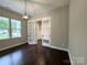 Home office showcasing French doors, wood floors, modern lighting, and a neutral color palette at 157 Powder Spring Dr, Statesville, NC 28677