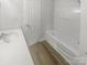 Bathroom with a single sink vanity and shower-tub combo at 16837 Greenlawn Hills Ct, Charlotte, NC 28213