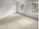 Bedroom with large double windows and neutral carpet at 16837 Greenlawn Hills Ct, Charlotte, NC 28213