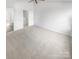 Bright room with neutral carpet and staircase entryway at 16837 Greenlawn Hills Ct, Charlotte, NC 28213