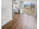 Open kitchen with stainless steel appliances and white cabinets, next to a dining area at 16837 Greenlawn Hills Ct, Charlotte, NC 28213