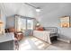 Cozy bedroom with neutral tones, natural light, and a comfortable seating area at 239 Euclid Ave, Statesville, NC 28677