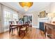 Elegant dining room featuring hardwood floors, fireplace, and decorative ceiling at 239 Euclid Ave, Statesville, NC 28677