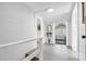 Bright hallway with white wood-paneled walls and doorway leading to a sunlit room at 239 Euclid Ave, Statesville, NC 28677