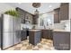 Stylish kitchen featuring stainless steel appliances, island, subway tile backsplash, and neutral cabinetry, combining modern design with charm at 239 Euclid Ave, Statesville, NC 28677