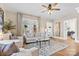 Bright living room with large windows, hardwood floors, stylish rug and comfortable seating at 239 Euclid Ave, Statesville, NC 28677