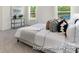 Serene bedroom with plush carpeting, a cozy bed, and plenty of natural light, creating a relaxing retreat at 265 Red Fox Ln # 1P, China Grove, NC 28023